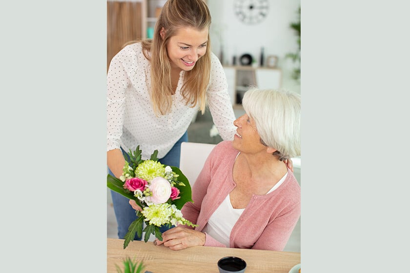 Mother and daughter with flowers