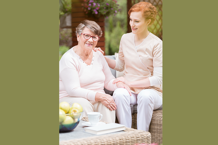 tender-professional-caregiver-uniform-putting-her-hand-shoulder